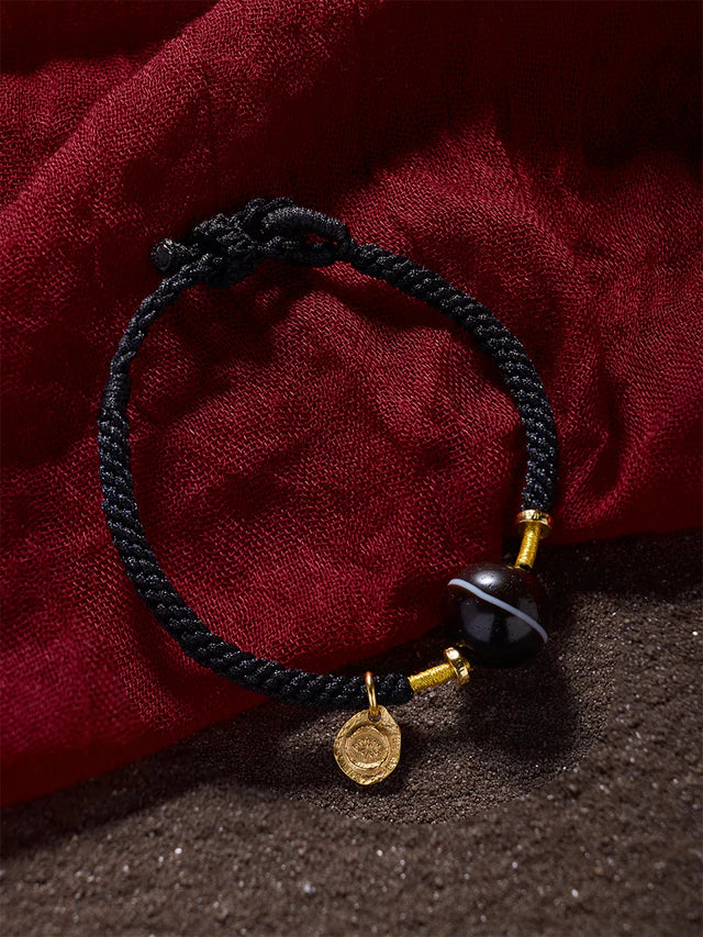 1_7101a74f-63c2-455d-bd31-23cdd0909b3f.jpg Single Line Dzi Bead Bracelet – Blessings of Protection and Spiritual Energy - Image 1